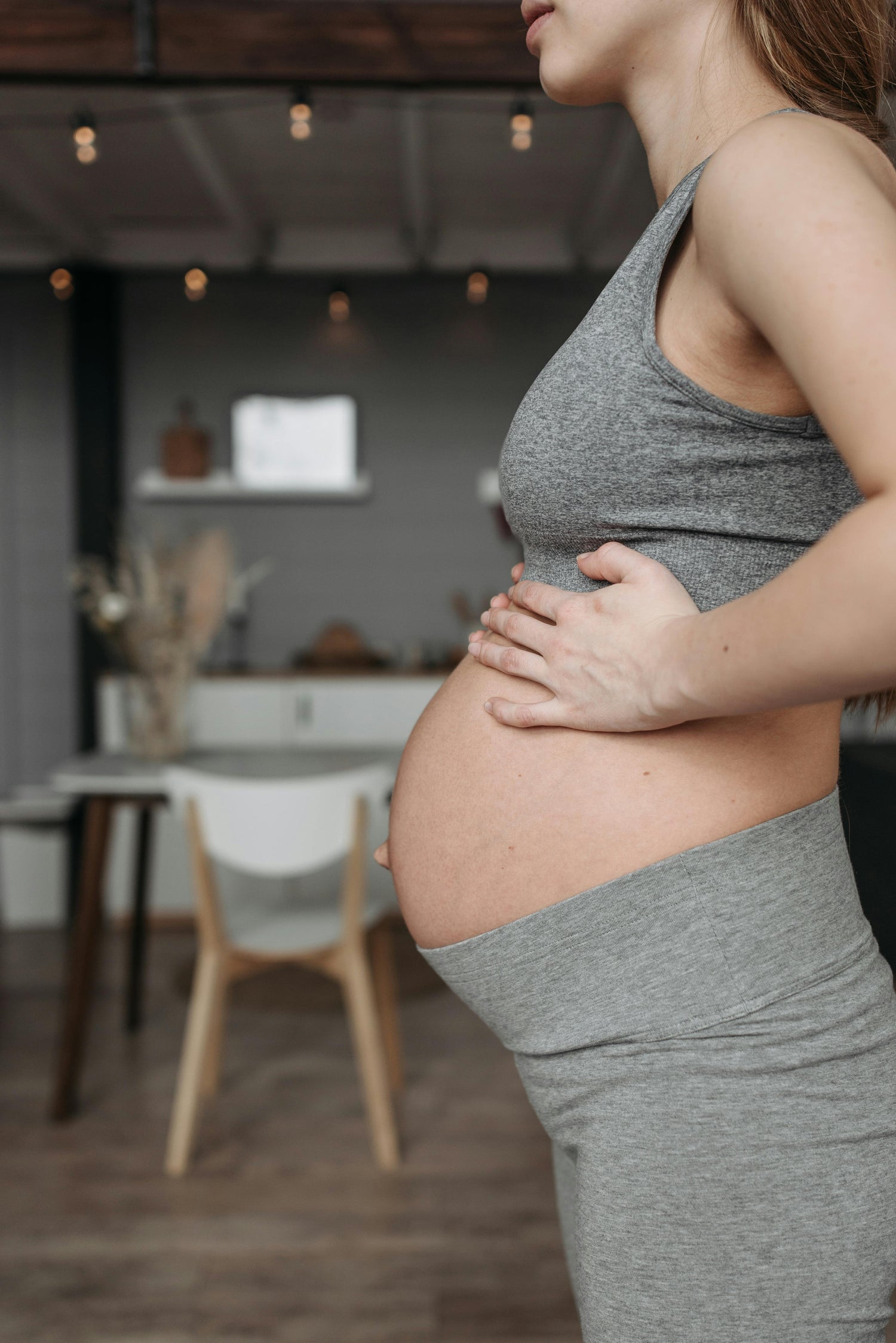 Postpartum woman doing core rehabilitation exercises to improve abdominal strength
